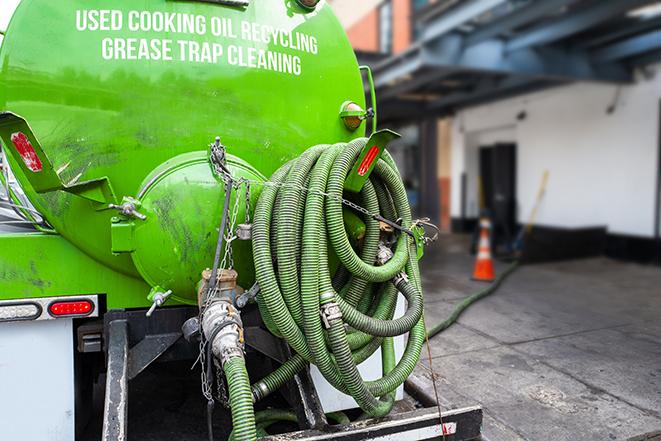 a grease trap pumping truck at a restaurant in Beverly Hills